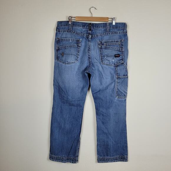 Ariat FR M4 Relaxed Boot Cut Jeans Mens 38x32 Blue Denim Work Distressed - Picture 3 of 9